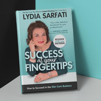 Success at Your Fingertips: How to Succeed in the Skin Care Business book leaning in corner of room