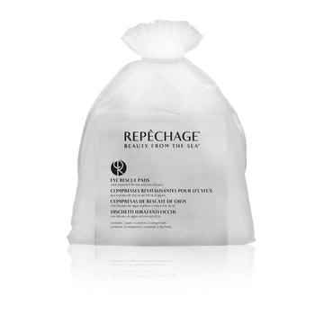 A sealed, white sachet labeled REPECHAGE with eye rescue pads visible through a small opening at the top.
