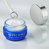 Opened Opti-Firm® Eye Contour Cream jar with mini massager