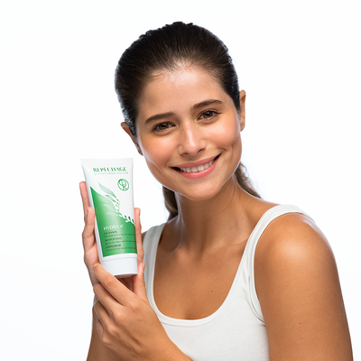 woman holding Hydra 4® Cleanser