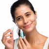 Woman applying Hydra Medic® Clear Complexion Drying Lotion to face