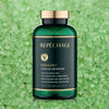 Vita Cura® CelluSea Renewal™ Dead Sea Bath Salts bottle in front of green bath salt background