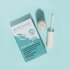 Hydra Medic® Clear Complexion Drying Lotion applicator next to packaging